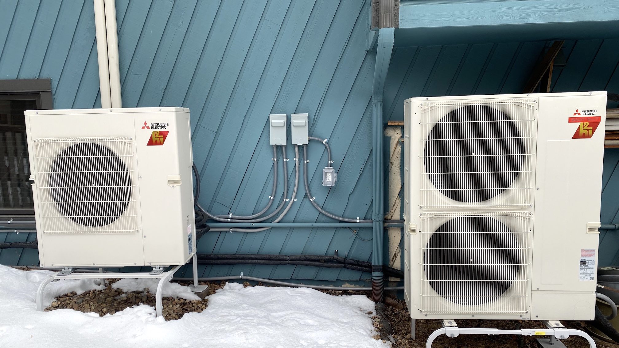 Two outdoor condensers as part of a home heat pump system 